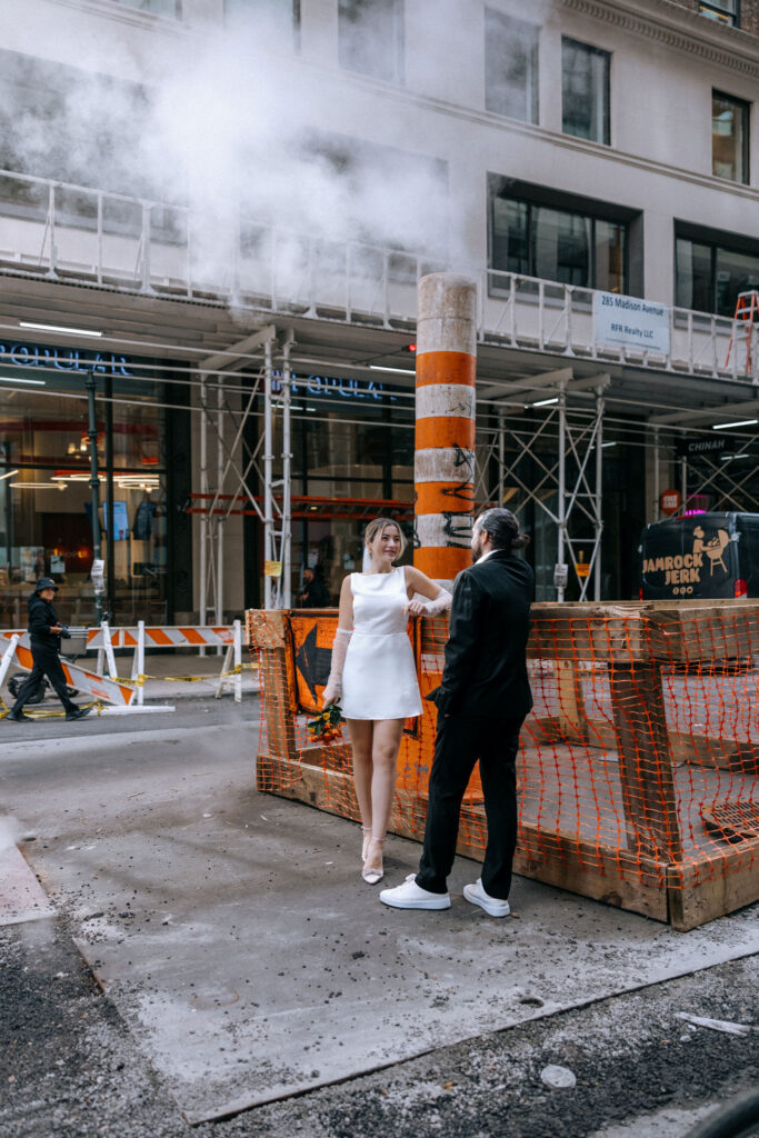 unique wedding photos of a couple by the iconic NYC steam pipes, showcasing their love in a distinctive urban setting with the city's charm.