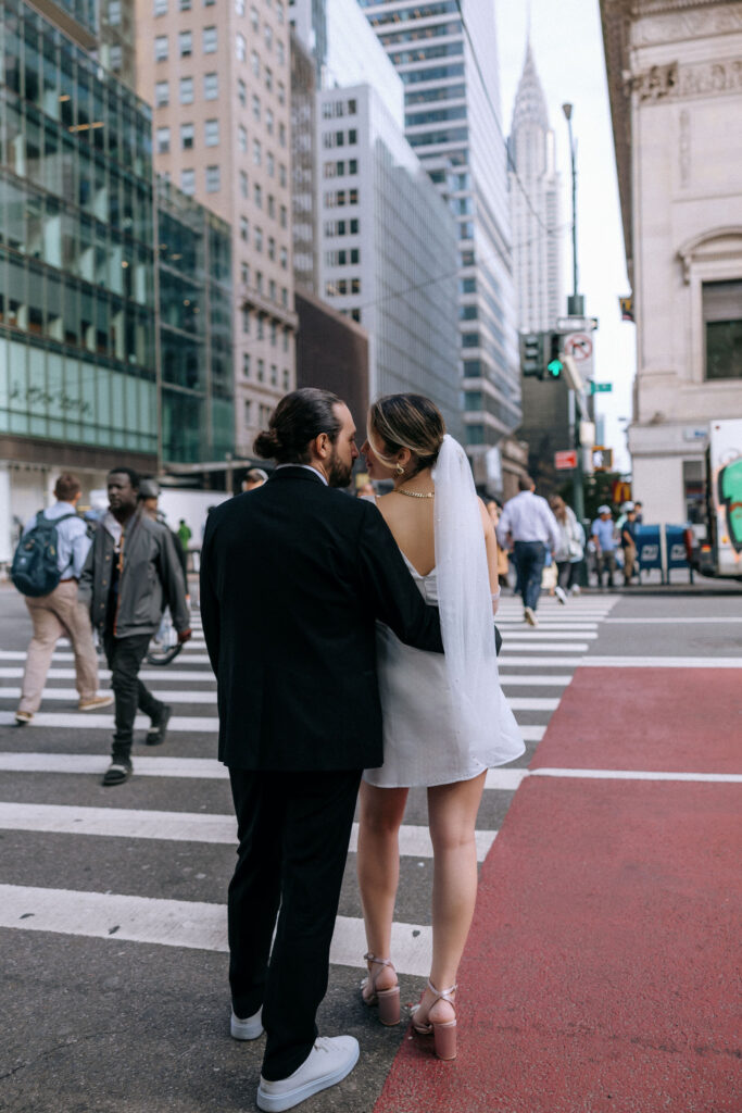 Couple sharing a tender moment in front of the Chrysler Building, highlighting their connection against the stunning NYC skyline.