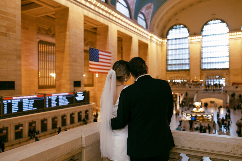 Couple exchanging tender moments during their elopement at Grand Central Terminal, capturing the magic of their special day in a historic setting