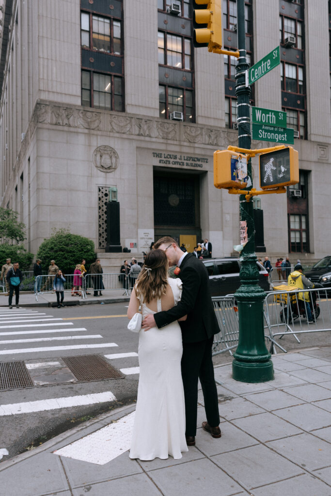 Couple eloping in front of NYC City Hall befor their wedding ceremony