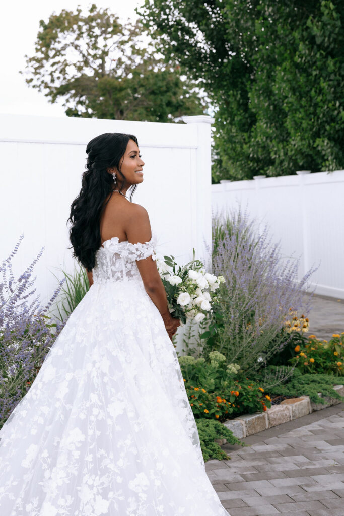 Elegant bride anticipating the first look, captured in a quiet, candid moment before her intimate wedding ceremony
