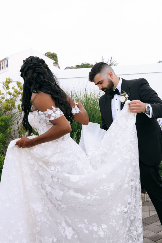 Bride and groom share intimate first moments together before the wedding ceremony, captured in a candid, romantic style.
