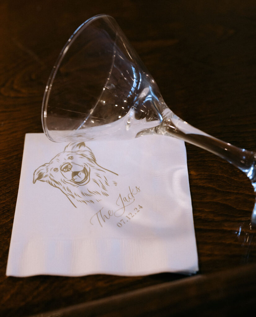 Custom wedding napkin with a personalized illustration of the couple's dog, adding a unique and playful touch to the wedding decor