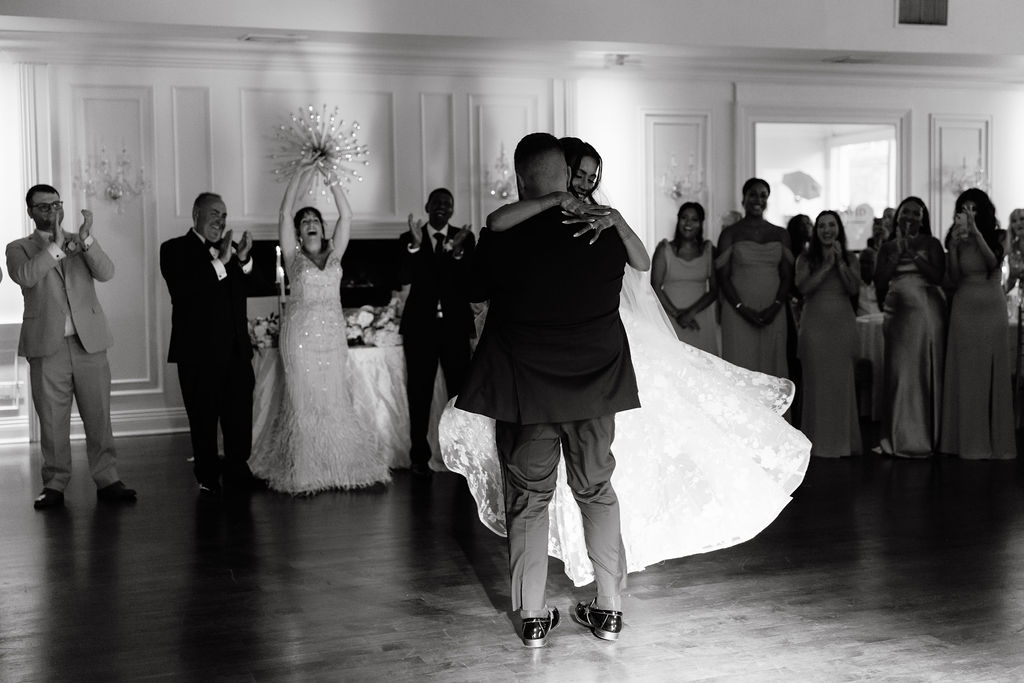 Bride and groom’s first dance, capturing a tender and emotional moment during the wedding reception.
