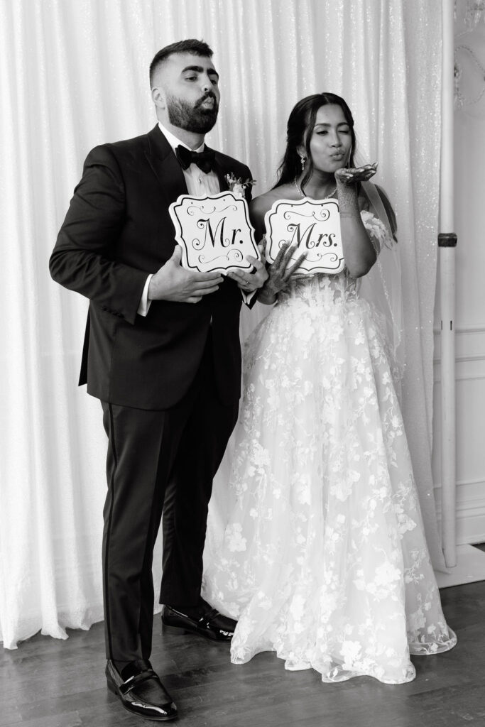 Bride and groom having fun together, showcasing their happiness and joy during the wedding reception
