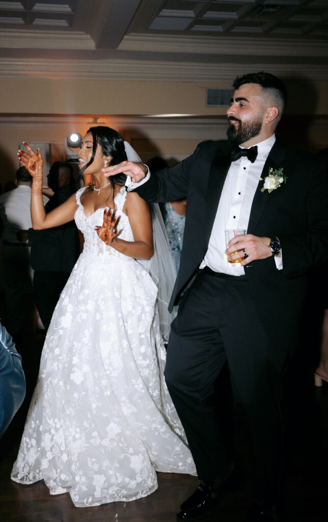 Couple dancing together on the wedding dance floor, enjoying a romantic and joyful moment during their celebration