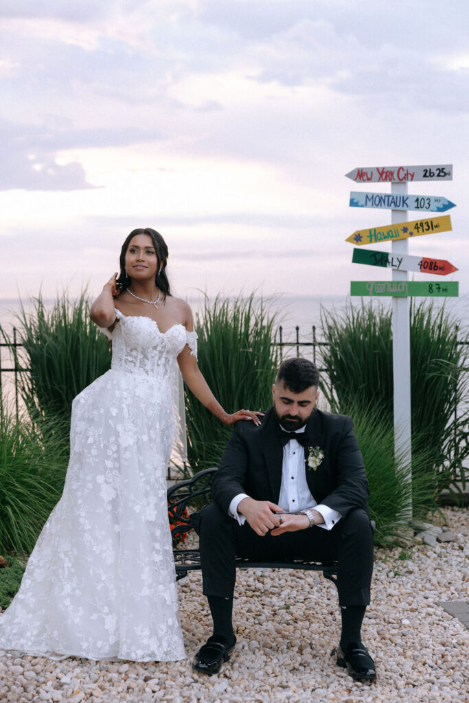 Couple embracing during sunset, with warm hues creating a magical backdrop for their wedding day photos