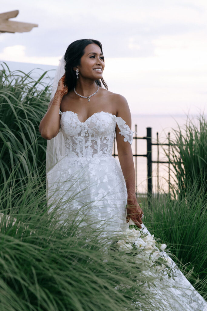 Stunning bride portrait capturing her elegance and beauty on her wedding day, highlighted by soft lighting and delicate details.