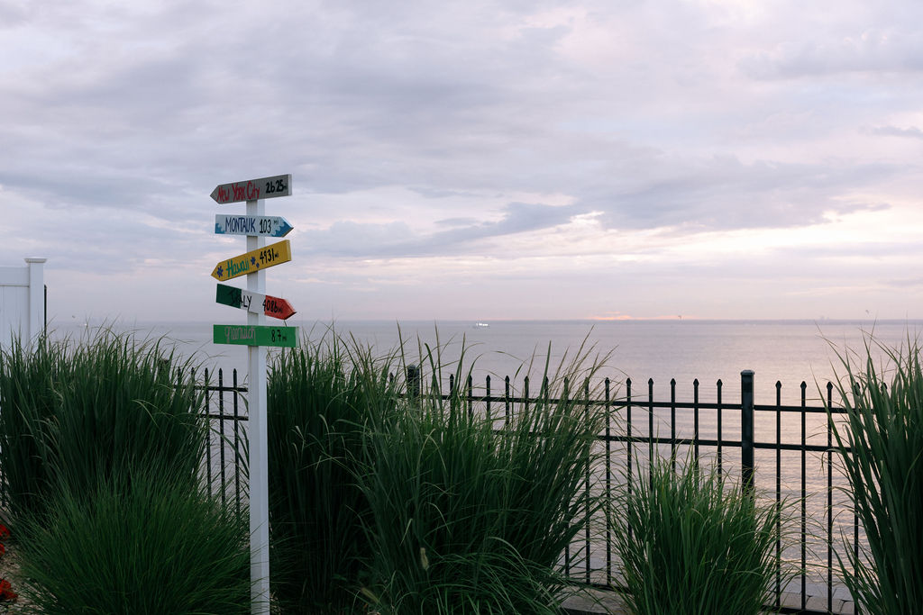 Breathtaking pink sunset over Long Island, creating a romantic backdrop for the couple’s wedding celebration