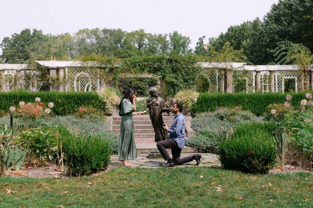 Couple engagement proposal at the Rose Garden in Brooklyn Botanic Garden captured by NYC proposal photographer Yelena Ku.

