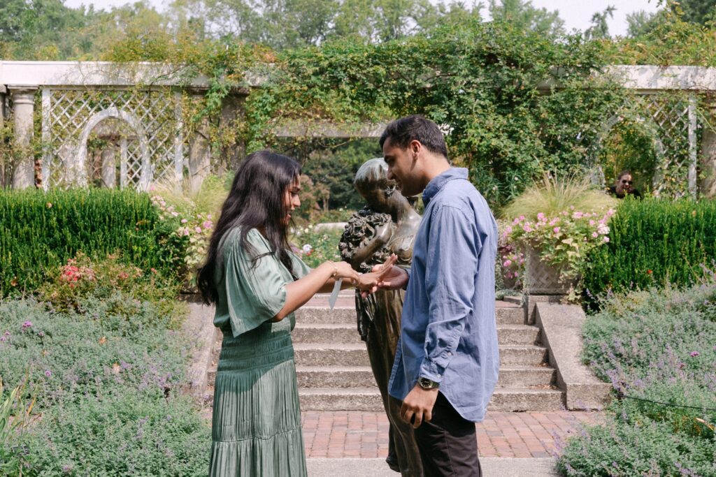 Surprise proposal at the Rose Garden in Brooklyn Botanic Garden, captured by NYC engagement and proposal photographer Yelena Ku.