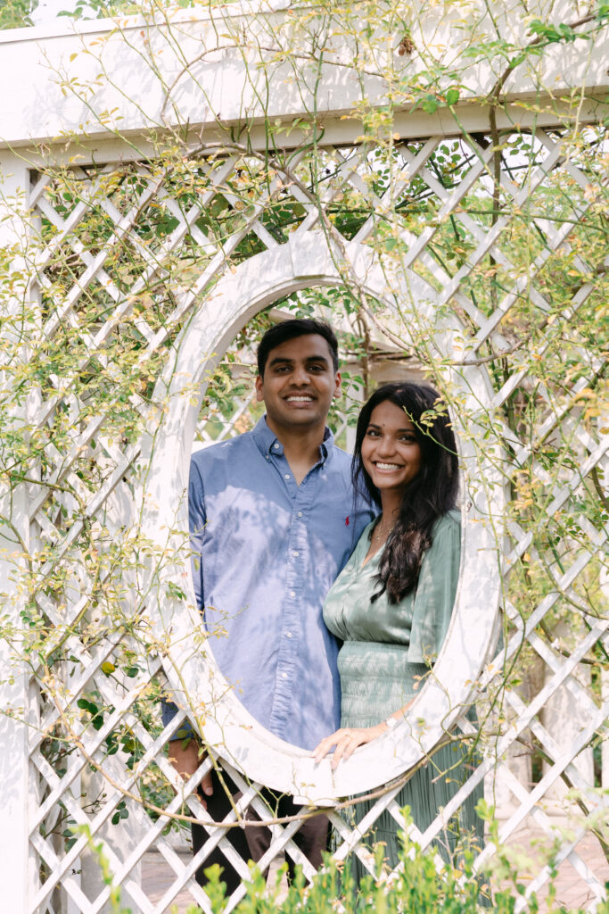Engaged couple portrait at the Rose Garden in Brooklyn Botanic Garden, captured by NYC engagement and proposal photographer.