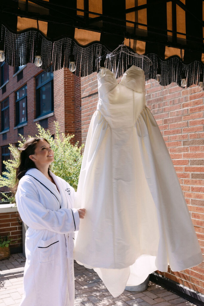 Wedding dress hanging outside a room at the SoHo Grand Hotel during getting ready
