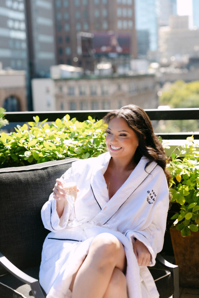 Bride relaxing on the terrace while getting ready at the SoHo Grand Hotel
