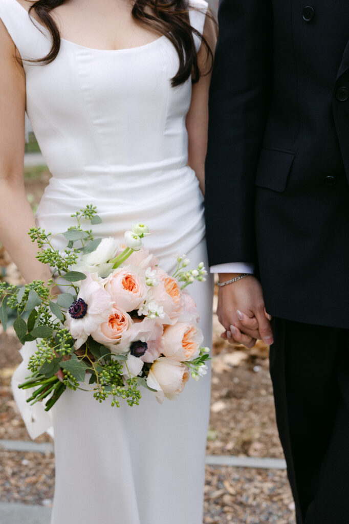 Bride holding a wedding bouquet in a white dress