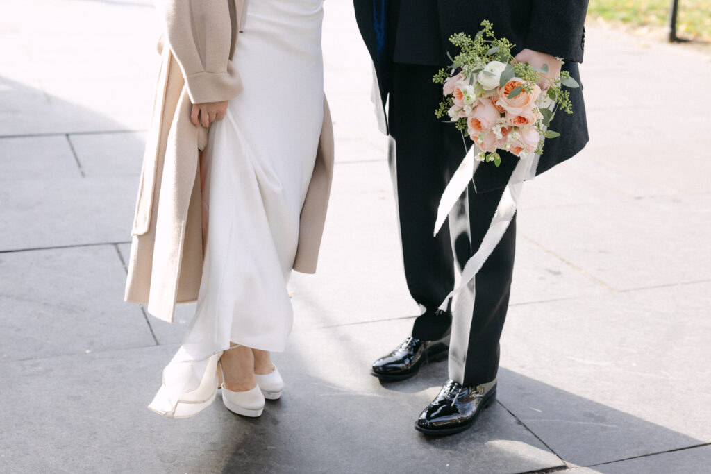 Close-up of bride and groom walking together after their City Hall wedding in New York