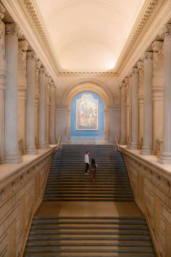 interior staircase at the metropolitan museum of art during a quiet nyc engagement session