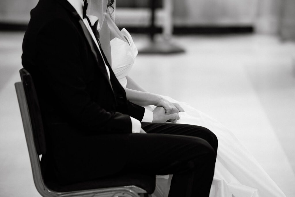 Guest seated during a wedding ceremony, captured in black and white at an intimate SoHo wedding in New York City