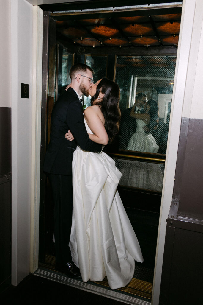 Bride and groom sharing an intimate moment inside a SoHo building on their New York City wedding day