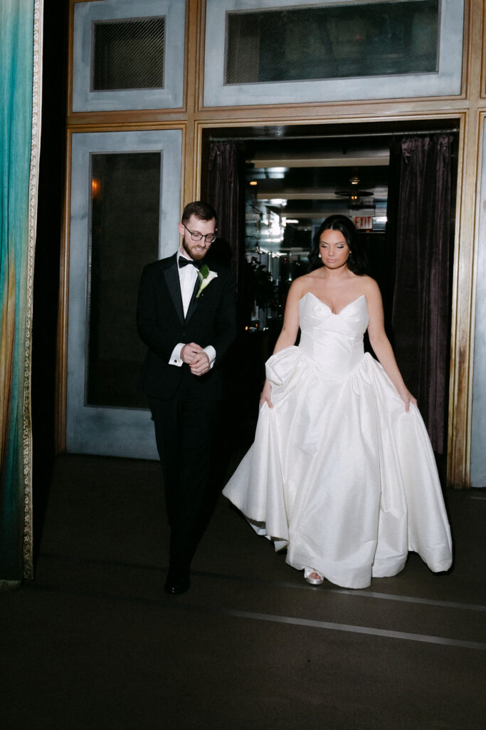 Bride and groom stepping out together after their SoHo wedding ceremony in New York City