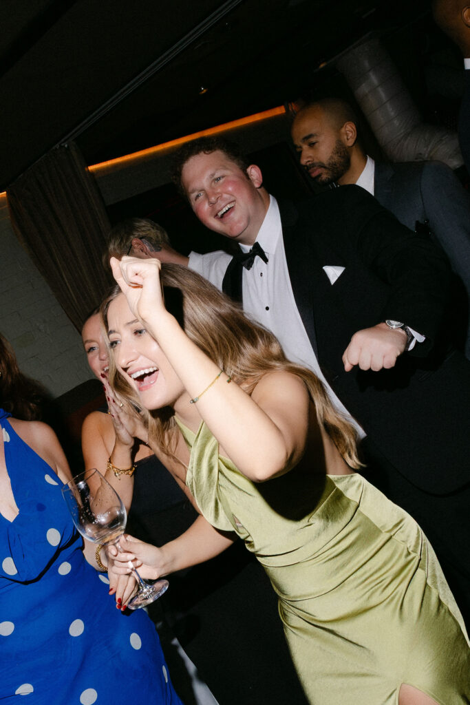 Guests dancing and celebrating on the dance floor during an intimate wedding reception in SoHo, New York City.
