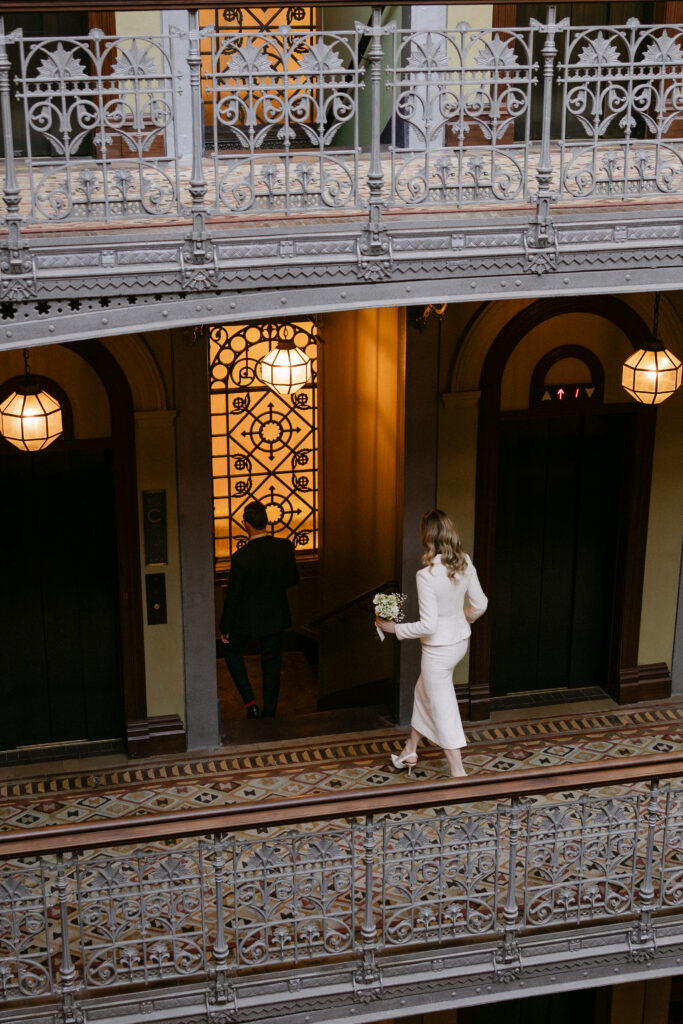 bride walking inside beekman hotel nyc elopement before city hall wedding photos