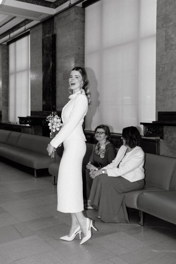 bride waiting at nyc city hall before elopement ceremony black and white moment