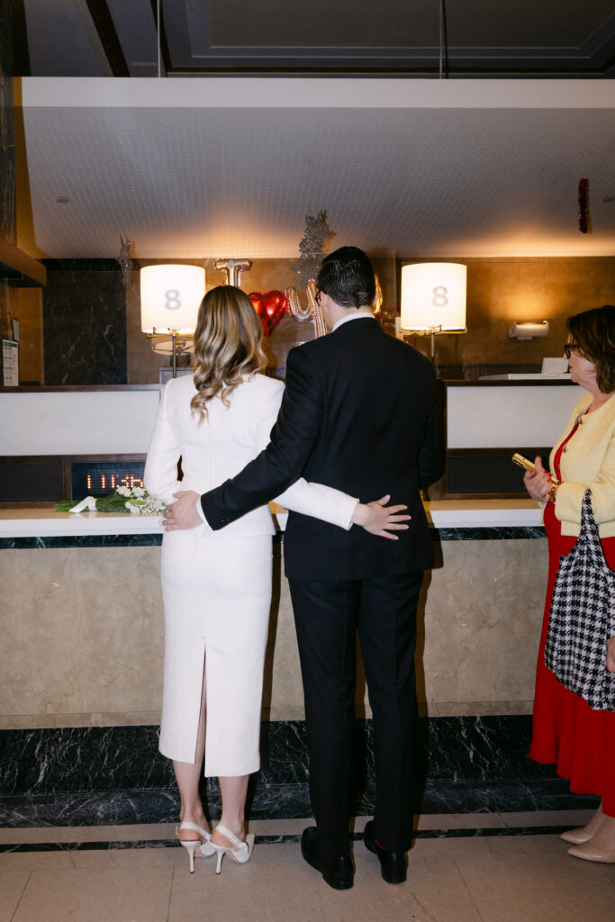 couple signing documents nyc city hall wedding elopement process moment