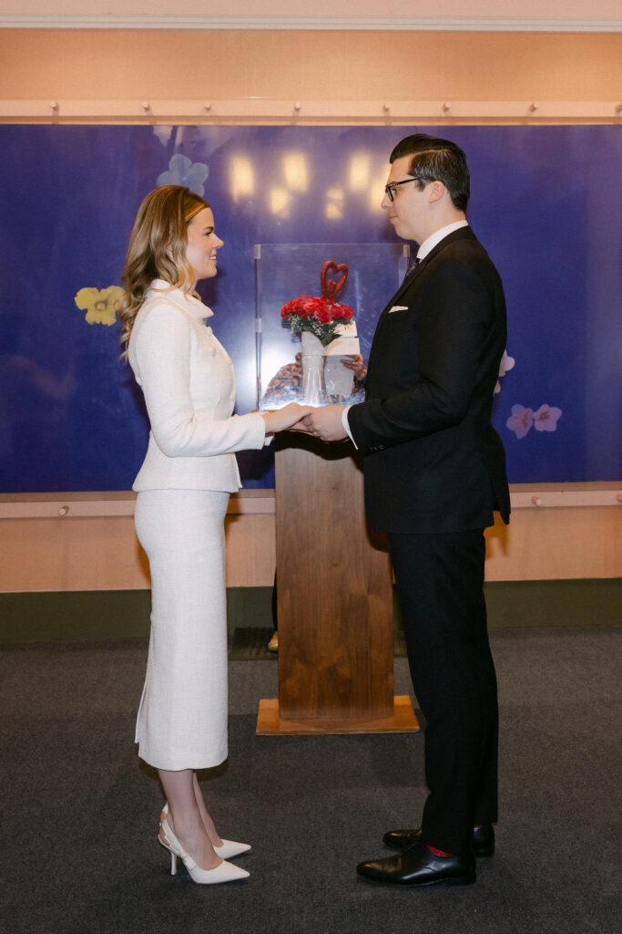 nyc city hall wedding ceremony couple exchanging vows elopement moment