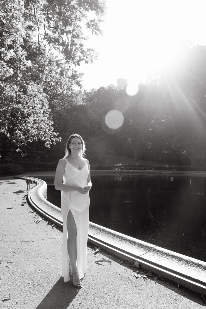 Engaged couple standing beneath the arches at Bethesda Terrace during their Central Park engagement session.