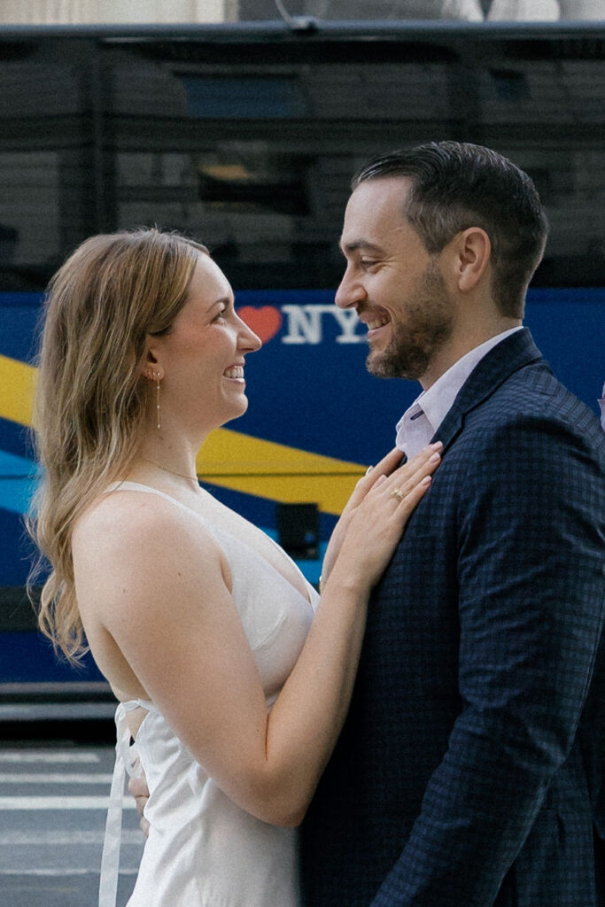 Candid close-up of an engaged couple smiling together during their Upper East Side engagement photo session.